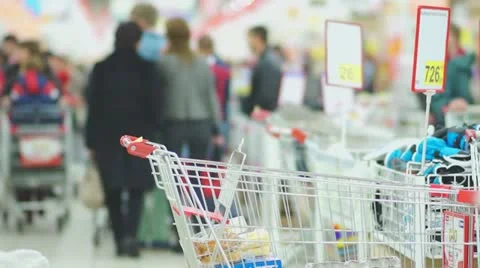Boxes with shopping carts and customers in supermarket Stock Footage 21248552