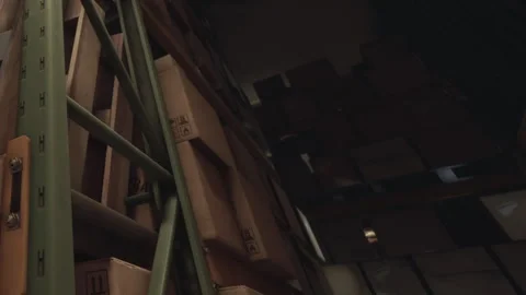 Boxes stacked high in a storage facility during the day Stock Footage 344845736