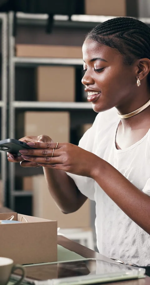 Boxes, supply chain and black woman with cellphone for picture, online review Stock Footage 332051597