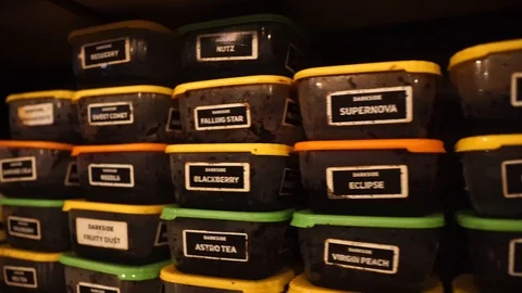 Boxes of tobacco for hookah. Stock Footage 88531879