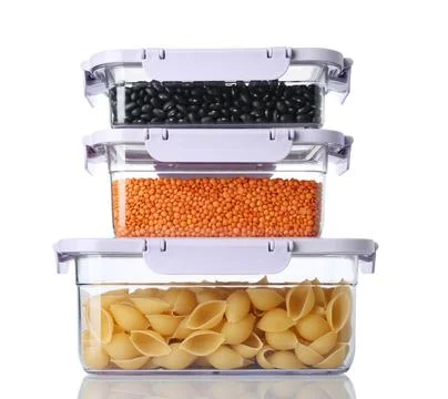 Boxes with uncooked products on white background Stock Photos