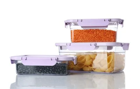 Boxes with uncooked products on white background Stock Photos