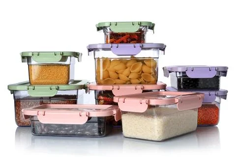Boxes with uncooked products on white background Stock Photos
