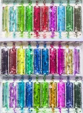 Boxes with wax crayons remains Stock Photos