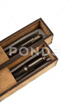 Boxes of wood handmade with gift pens inside on a white background, isolate. Stock Photos