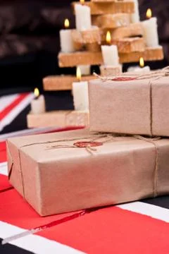 Boxes, wrapped into craft paper, fixed with packthread with a wafer Stock Photos