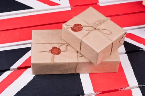 Boxes, wrapped into craft paper, fixed with packthread with a wafer Stock Photos