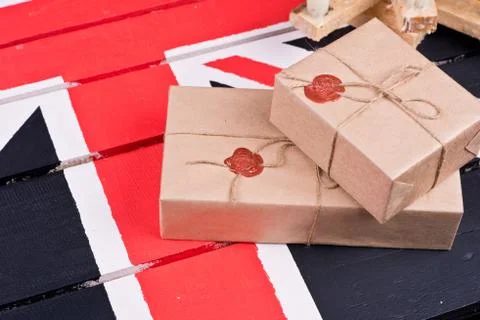 Boxes, wrapped into craft paper, fixed with packthread with a wafer Foto stock