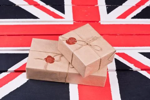Boxes, wrapped into craft paper, fixed with packthread with a wafer Stock Photos
