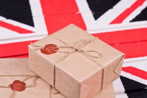 Boxes, wrapped into craft paper, fixed with packthread with a wafer Stock Photos