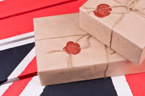 Boxes, wrapped into craft paper, fixed with packthread with a wafer Stock Photos