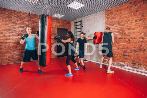 Boxing Aerobox Group With Personal Trainer Man At Fitness Gym, Gloves, Punching