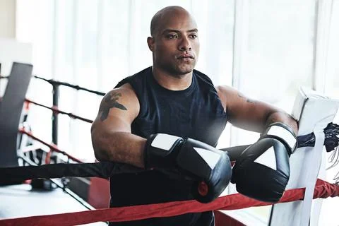 Boxing is all about being physically and mentally tough. a man training in a Stock Photos