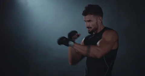 Boxing athletic guy charismatic in front of the camera he have a hard workout in Stock Footage 116899640