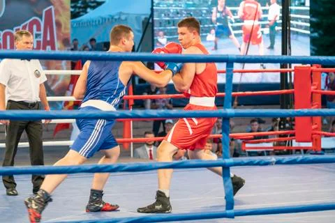 Boxing, a Boxing match between two blue and red boxers Stock Photos