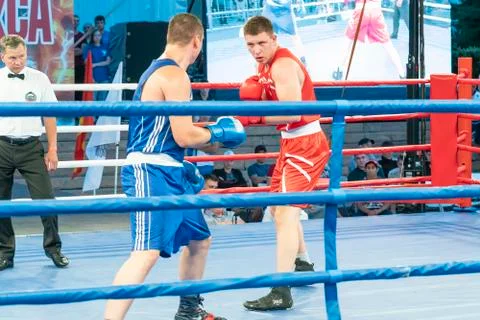 Boxing, a Boxing match between two blue and red boxers Stock Photos