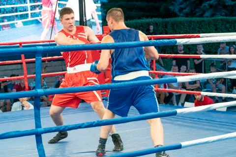 Boxing, a Boxing match between two blue and red boxers Stock Photos