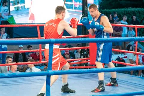 Boxing, a Boxing match between two blue and red boxers Stock Photos