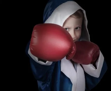 Boxing boy on black background Foto stock
