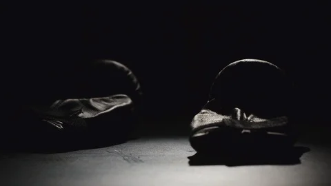 Boxing gloves fall down - Slow Motion Stock Footage 99672912