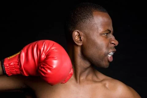 Boxing man punching Stock Photos