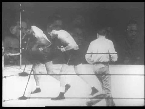 A boxing match between Joe Louis and Max Schmeling is shown, in 1938. Video stock 75007584