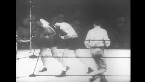 A boxing match between Joe Louis and Max Schmeling is shown, in 1938. Video stock 145481220