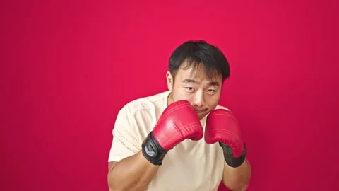 Boxing over isolated red background Video stock 247386912
