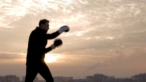 Boxing training an sunset of big city Stock Footage 83325516