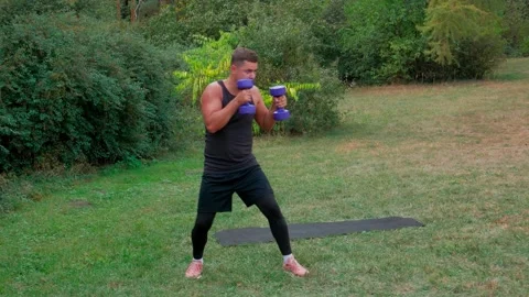 Boxing training workout outdoor. Guy boxing dumbbell Stock Footage 146360645