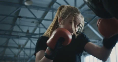 Boxing woman training with coach on ring Stock Footage