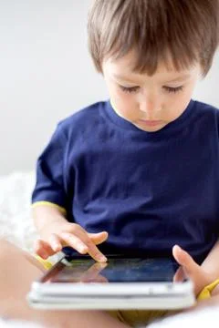 Boy (2-3) playing with digital tablet Stock Photos