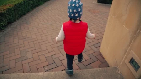 Boy 2 years old, going down the stairs. Close-up of legs and general shot Stock Footage 153559880