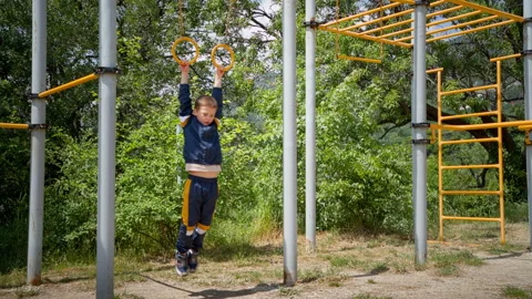 The boy is 7 years old and he enjoys playing sports. Stock Footage 274756148