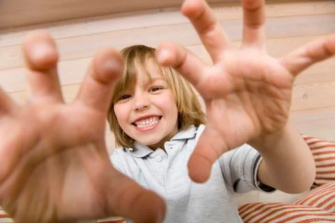 Boy (8-9) making faces, portrait Stock Photos
