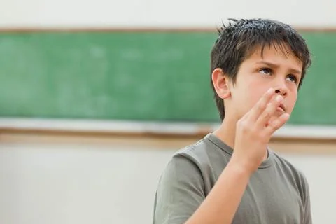 Boy acting cool in class Stockfoto's