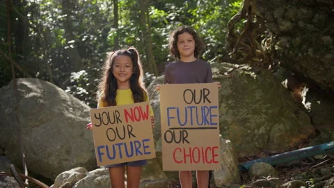 Boy activist with Our future our choice Poster. Girl kid volunteer holding Your Stock Footage 191455708