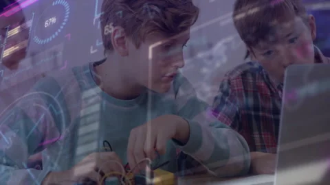 Boy adjusting wires triggers overlay showing upload progress while friend typing Stock Footage 312656101