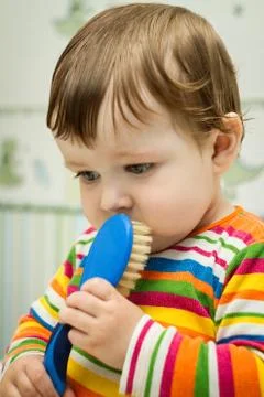 Boy after bath with comb 스톡 사진