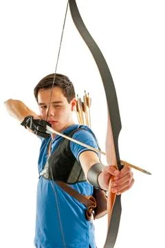 Boy aiming with bow an arrow Stock Photos