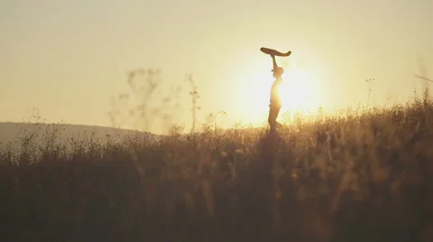 Boy with the airplane in hand runs on the background of sunset Stock Footage 56907882
