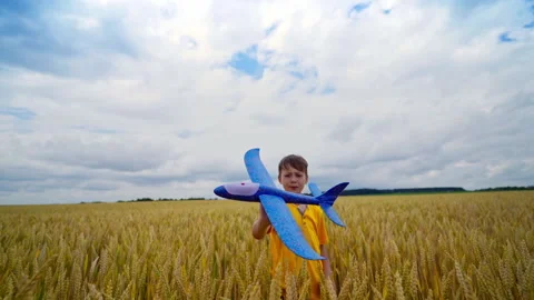 Boy with airplane toy Stock Footage 135985293