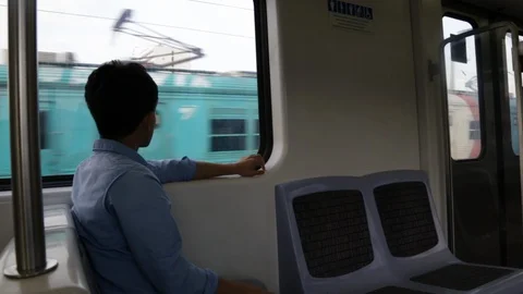 Boy alone looking outside the trains's window Video stock 88442016