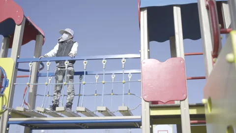 Boy alone in the playground  Stock Footage 141609470