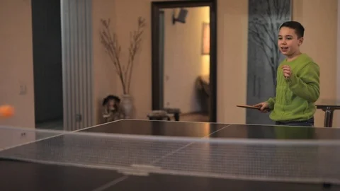 Boy alone plays table tennis in the room Video stock 126669992