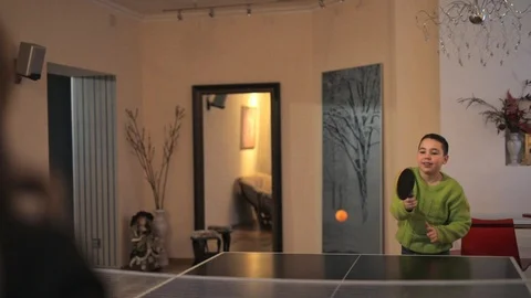 Boy alone plays table tennis in the room Video stock 126670014