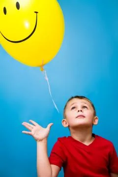 Boy and balloon Stock Photos