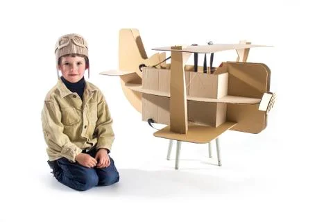 Boy and biplane. Stock Photos