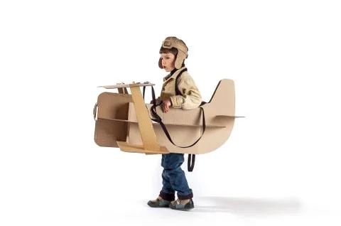 Boy and biplane. Stock Photos