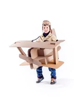 Boy and biplane. Stock Photos